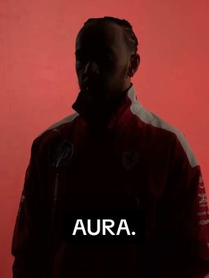 A post by @puma on TikTok caption: 'Define aura' Lewis Hamilton: #PUMA #Motorsport #LewisHamilton #Ferrari #ScuderiaFerrari @ferrari 