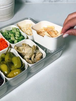 A post by @kellie_atkinson on TikTok caption: Mini salad bar 🥒🌱 #asmr #mealprep #salad #saladbar #workfromhome #mealprepideas 