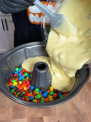 A post by @fooddudescook on TikTok caption: M&Ms bundt cake recipe #dessert #easycooking #simplemeal