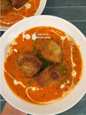 A post by @zoebarriesode on TikTok caption: arancini with tomato soup! in 20 mins! #cooking #dinner #recipes 