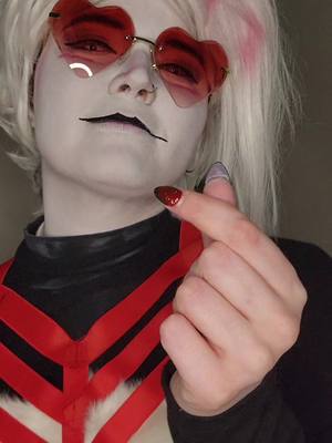 A post by @foxboi_cos on TikTok caption: Heheheh the transition be so good <3 #AngelDust #AngelDustCosplay #Angel #HazbinHotel #HazbinHotelCosplayer #AdultCosplayer #FTMTrans #Genderfluid 