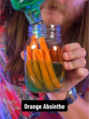 A post by @dokaryan on TikTok caption: I left Orange Twizzlers in Absinthe for a week #yqr #dokaryan #fyp #bartender #absinthe #twizzlers 