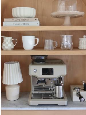 A post by @teresalauracaruso on TikTok caption: Set-up my coffee cabinet with me 🤎 Love how this little space turned out! #coffeecorner #coffeesetup #organizedhome #organizewithme #coffee #amazonfinds #breville #espressomachine #crateandbarrel #anthropologie #targethome #neutralhomedecor 