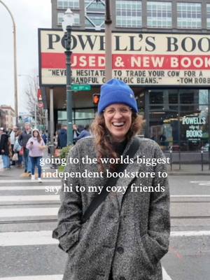 A post by @megstearoom on TikTok caption: Had so much fun wandering through @Powell’s Books during our Portland visit and saying hi to all the cozies! #megstearoom #cozyfantasy #cozyreader #cozybooktok #BookTok #CapCut 