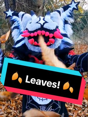 A post by @x_razzer_x on TikTok caption: 🍂 Playing in the leaves! 🍂 ⋆ #furries #furry #autumnfurry #fursuiting 