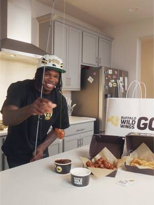 A post by @_travishunter on TikTok caption: Best way to dip wings @Buffalo Wild Wings #partner