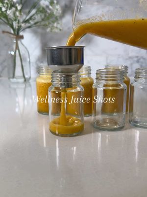 A post by @kellie_atkinson on TikTok caption: Wellness shots 🍋🫚 Ib: @kaeli mae  💛 2 oranges, 3 lemons, ginger, 1 tbsp turmeric, 1 tbsp black pepper #juice #wellnessshots #gingershot #immunitybooster #juicer #juicerecipe #antiinflammatory 