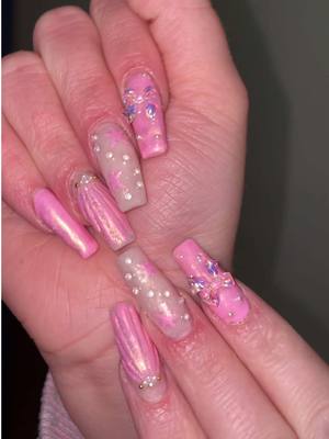 A post by @breedutkiewicz on TikTok caption: I did my sisters nails👀🩷  #nails #nailart #nailtransition #nailtok #beachnails 