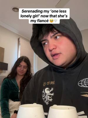 A post by @kobeewhite on TikTok caption: hits a little different now 🤍💜  one less lonely girl - #singing #singer #reaction #reactionvideos #reactionvideo #fiance #justinbieber #onelesslonelygirl 