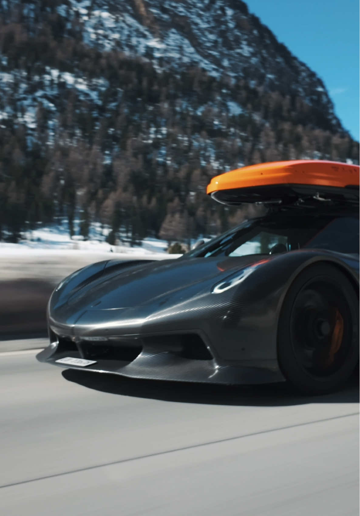 A post by @koenigsegg on TikTok caption: Who needs a ski lift when the 1600 hp KNC Koenigsegg Jesko Absolut does the job so well! #Koenigsegg #Jesko #Absolut Video by @Alpineracer and Carage Lucerne 