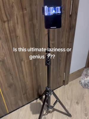 A post by @mr.jrzu on TikTok caption: this heavy duty tripod be great for those whose neck get tired but are determined to stay on their tablets or phones & plus i love it bc its peak laziness for me #tripod #ttsdelightnow #mrjrzu #tripodstand #iphone 