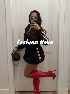 A post by @iammadidenise on TikTok caption: @Fashion Nova #fashionnovapartner  🔎 Diet Coke Baddie Baby Tee - White/combo (medium) 🔎 That's Hot Mesh Capri Legging - Red/combo (medium) 🔎 Sporty Bubble Hem Skirt Set - Black (medium) 🔎 Big City Girl Knee High Heeled Boots  #gdwm #charlottenightlife #foryourpage 