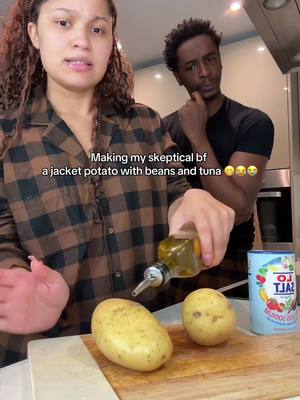 A post by @mudyandshamy on TikTok caption: Him grinning the whole time he’s eating it😂😂 #jacketpotato #britishfood #mudyandshamy #foodreview #lunchideas 