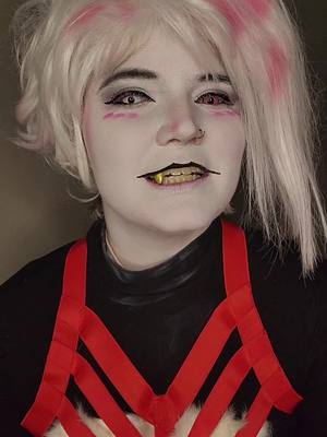 A post by @foxboi_cos on TikTok caption: @Theo Imma just leave this for you to duet later 😽 #AngelDust #AngelDustCosplay #Angel #HazbinHotel #HazbinHotelCosplayer #AdultCosplayer #FTMTrans #Genderfluid 