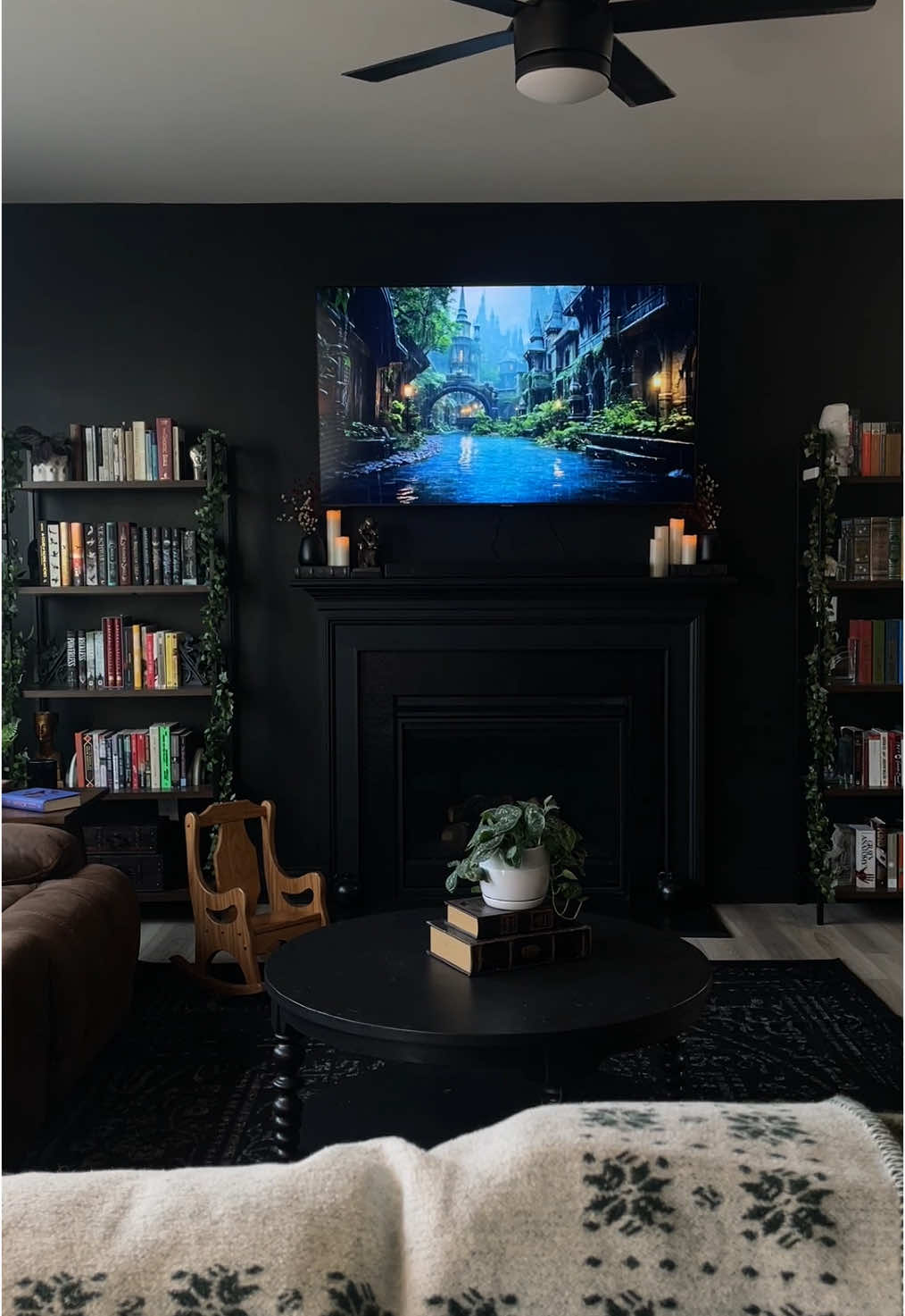 A post by @kcallanott on TikTok caption: 📖 #homedecor #bookworm #homeinterior #darkacademia #booklover #blackwalls #gothicdecor #darkaesthetic #cozyathome #darkinterior #readersoftiktok #gothichome 