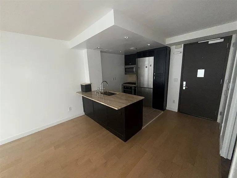 A post by @crownrealestatecompany on TikTok caption: 1 Bedroom Apartment 777 sqft  Rent: $880 Per Month Including Utilities  Located at 333 Rector Pl, APT 903, New York, New York Description: Prime location featuring a private balcony with scenic views of the Hudson River. This apartment includes a washer and dryer, a 24-hour doorman, a fitness center, and a lounge equipped with a theater. It is available for immediate occupancy. Conveniently located near the World Trade Center, grocery stores, Brookfield Plaza, and several subway lines at the Oculus and Fulton Street stations. Interested applicants must submit an application to the condo board. The heating and cooling are managed by packaged terminal air conditioner (PTAC) units, with one unit located in the living room and another in the bedroom. To schedule an appointment for viewing, text me at (315)395-5812  #apartmenthunting #curbappeal #dreamhome #forrent #forsale #Home #homesforsale #househunting #justlisted #justlisted + city. #justsold #midcenturymodern #newhome #newlisting #petfriendly #propert #realestateforsa #renovated #turnofthecentury #victor