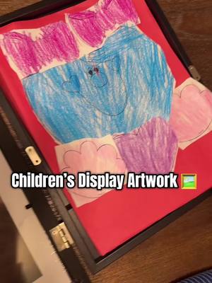 A post by @breecoolmom on TikTok caption: This picture frame is perfect for displaying your kids artwork. #pictureframe #pictureframes #displayframe #artworkframes 