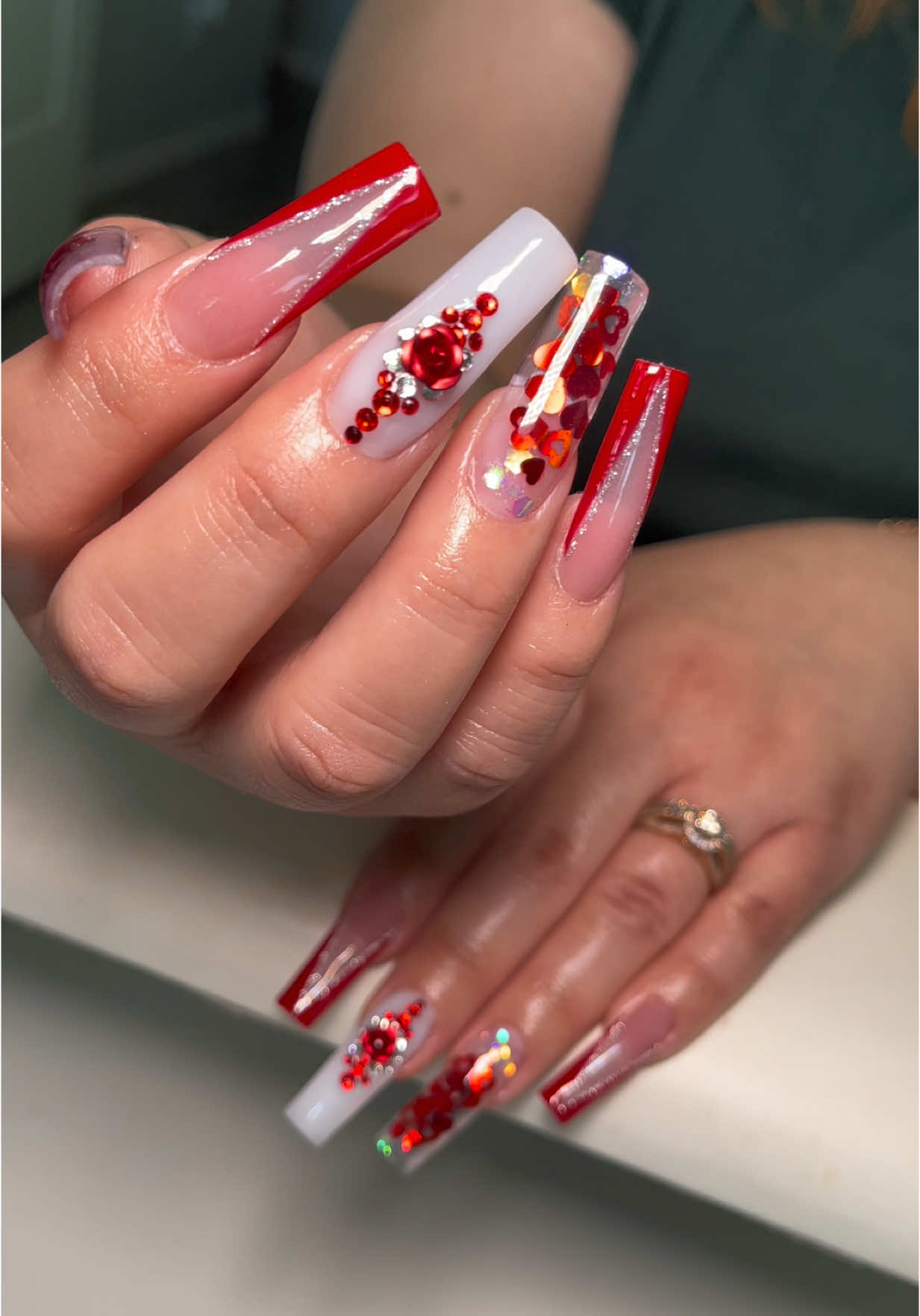 A post by @_nailzbymariah_ on TikTok caption: #nailzbymariah #goodyearnailtech #aznails #athomenailtech #fyp #explorepage #vbeautypure #beetlesgelpolish #kupatopcoat #nailsandblinks #encapsulatednails #valentinesdaynails #rednals #vcutnails 