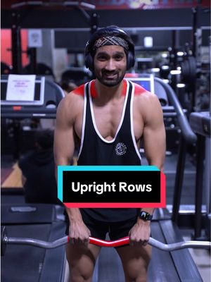 A post by @hazzytrainer on TikTok caption: Avoid Doing Upright Rows Like This ⚠️ . By Taking a Closer Grip, and performing Upright Rows, this will increase the risk of Shoulder Impingement. ⚠️ So Instead, Grab the Bar at Shoulder Width Grip. ✅ Slightly Lean Forward, and then Raise your Elbows to the Sides. ✅ This way you effectively Train your Shoulders & Traps safely while performing this Shoulder Movement. 🔥 Save this for if you don’t remember the last time you did Upright Rows 😂 . Keep crushing it warriors 💪🏽 . #shoulders #delts #shoulderworkout