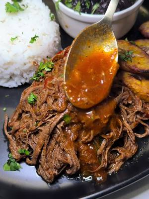 A post by @cooking_with.kian on TikTok caption: Authentic Cuban Ropa Vieja w/ @Alex Rios 🇨🇺🔥 recipe ⬇️ Meat 2 pounds flank steak 1 large yellow onion thinly sliced 1 of each large green and red bell pepper, thinly sliced 4 cloves garlic minced 2 tsp dried oregano 2 tsp ground cumin 2 tsp paprika 2 tsp salt 1/2 tsp black pepper 1/2 cup dry white wine 1 cup beef broth 16 oz tomato sauce 6 oz can tomato paste 2 bay leaves Cut your flank steak into 4-5 inch chunks. Season with salt and pepper. In a pot on medium high heat, sear on all sides. Remove from the pot and sauté onions and peppers for 2-3 minutes. Add garlic and once fragrant add tomato paste along with all seasonings. Cook down for 2-3 minutes. Deglaze with white wine and let most of it evaporate. Pour in tomato sauce & beef broth along with salt to taste & bay leaves. Add meat back in. Pressure cook for 40-45 min. Once done, shred and add back to the sauce. Sweet Plantains (Maduros) 2-3 ripe plantains Avocado oil spray Slice diagonally 1/2 inch. Thoroughly spray with oil, air fry 380F for 5 min, flipping occasionally. Air fry again 400 for 5 min until golden brown.
