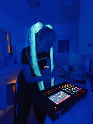 A post by @sorana on TikTok caption: Turning my kitchen into a club every night of the week. #livemusic #electronicmusic #popmusic #darkpop #nightcore #anime #cosplay #wighair #sorana 