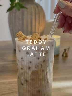 A post by @homewithhellen on TikTok caption: Now I understand why this drink is viral! 🧸☕️ Ingredients: @Nespresso Bianco Doppio with brown sugar, cinnamon and honey. Foam is heavy cream, vanilla syrup and dash of cinnamon. Pour over your favorite milk, I’m using oatmilk.  #teddygraham #teddygrahamlatte #latterecipes #athomecoffee  #coffee #coffeetok #cafe #nespresso #nespressovertuo #nespressovertouplus #homedecor #neutralhome #neutraleasthetic 