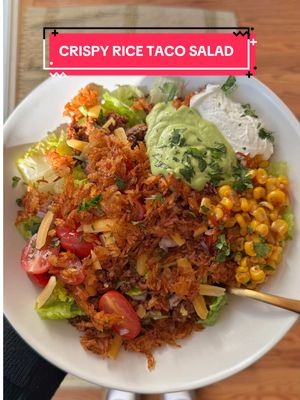 A post by @caileeeats on TikTok caption: crispy rice taco salad with avocado lime dressing 🥑🥗✨full recipe below!  what you’ll need:   for the ground beef mixture: 1lb ground beef  1 packet taco seasoning of choice  for the crispy rice:  2 cups cooked and cooled long-grain rice  2 tbsp olive oil  2 tbsp choice of taco sauce  generous sprinkle of paprika, chili powder, garlic powder, and onion powder.   for the avocado lime dressing:  2 large ripe avocados 1/2 cup fresh cilantro  Juice of 1 lime 3 tbsp olive oil  1 tbsp apple cider vinegar  2 garlic cloves  1/3 cup water (or more, to thin)  Salt and pepper, to taste  optional add-ins: Chopped romaine lettuce  Diced tomatoes  Diced red onion  Avocado Shredded cheese Salsa  Sour cream  instructions: 1. Preheat the oven to 400 degrees.  2. Place the cooked & cooled rice on a parchment-lined baking sheet. Drizzle on the olive oil and taco sauce and season generously with chili powder, paprika, garlic powder, and onion powder. Mix well and spread the rice out to an even layer.  3. Bake in the oven for 30-40 minutes, mixing halfway through, until crispy. Keep a close eye on it because the rice can quickly burn.  4. Add all the dressing ingredients to a blender and blend them on high until smooth. Taste and add more salt and lime juice as necessary. Place in the fridge until you’re ready to plate.  5. Preheat a large skillet to medium-high heat and add the ground beef. Cook for 7-10 minutes or until fully cooked. Add your choice of taco seasoning and mix well.  6. Once all the salad items have been prepped, it’s time to plate! To each bowl, add some romaine lettuce, taco meat, and a choice of salad toppings. Top with the crispy rice and avocado lime dressing and enjoy.    #EasyRecipe #healthydinneridea #easydinneridea 