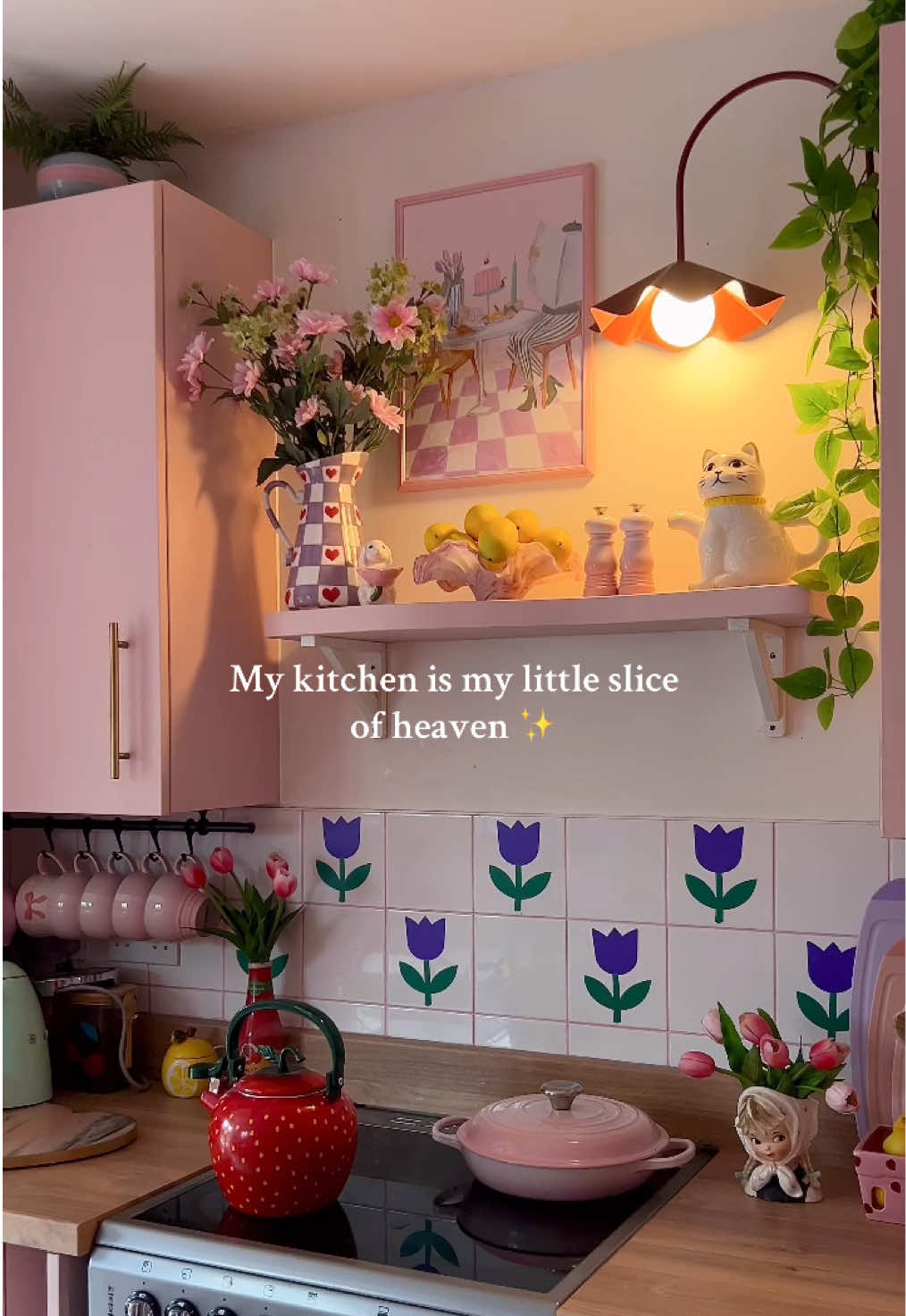 A post by @kate_rose_morgan on TikTok caption: My pink kitchen is my favourite room in my house 💕 #pinkkitchen #colourfulhome #colourfulkitchen #kitsch #diykitchen #cosykitchen #kitchenlamp #kitschdecor #kitchendecor 
