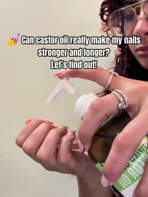 A post by @niaa321 on TikTok caption: Trying castor oil on my nails… does it actually work? 🤔💅 Watch till the end! #NailGrowth #CastorOilMagic #StrongerNails @RejuveNaturals 
