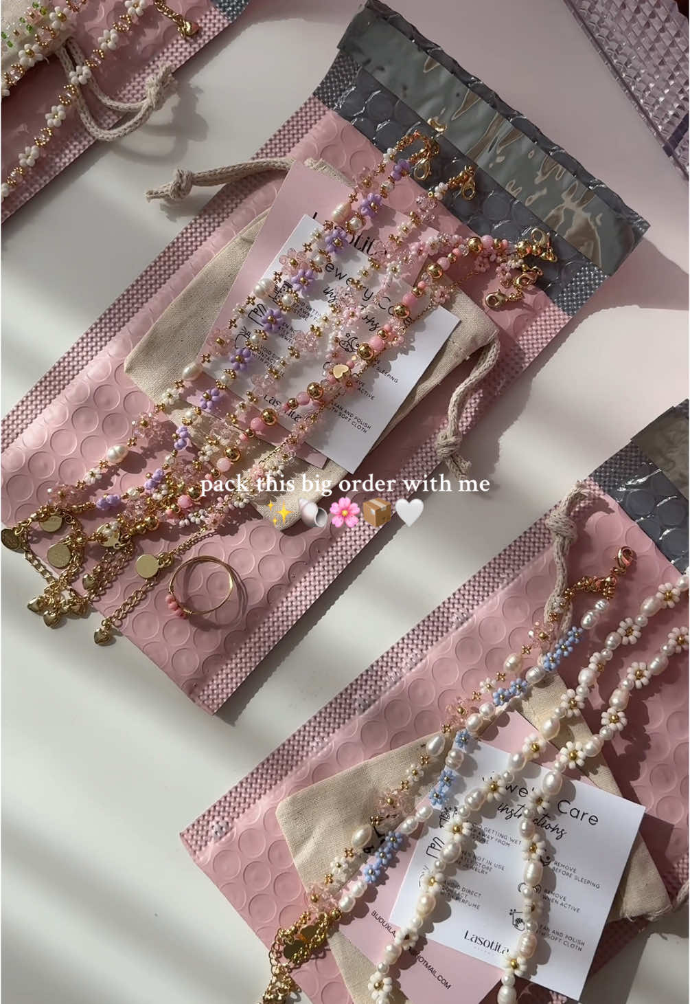 A post by @bijouxlasotita on TikTok caption: Packing big orders >>>🤍📦🌸✨🐚  Thank you so much for your order Amandine! 🇫🇷📍🫶🏻 . . #SmallBusiness #handmadejewelry #handmadejewelrybusiness #beadedjewelry #beadedbracelets #canadiansmallbusiness #handmaderings #packingorders 