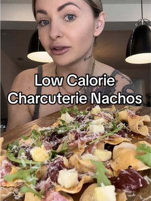 A post by @trainwithshay on TikTok caption: Low Calorie Charcooch Nachos 🔥 1 bag wilde chips- 210 cals, 13P, 10C, 13F 2 laughing cow wedges- 50 cals, 4P, 2C, 3F 1 tbs (7g) parmesan- 28 cals, 2P, 0C, 2F salami (28 grams, 6 small slices)- 100 cals, 7P, 0C, 8F sugar free jam 2 tbs (40 grams)- 10 cals, 0P, 10C, 0F hot honey- 1 tbs (21g)- 70 cals, 0P, 17C, 0F small handful of arugula- 0 cals 468 cals, 26P, 39C, 26F MY COOKBOOK IS OUT NOW! www.trainwithshay.com/cookbook