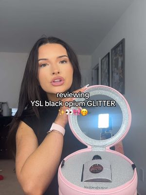 A post by @jade.amberrrrr on TikTok caption: trying the new @YSL Beauty YSL black opium glitter perfume ✨🎀🤭