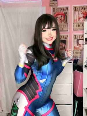 A post by @kora.aura on TikTok caption: GUESS WHOS LIVE ON TWITCH (i know im 4 hours late💔) #dvacosplay #dvaoverwatch #overwatchcosplay #overwatch2 #cosplaydance 