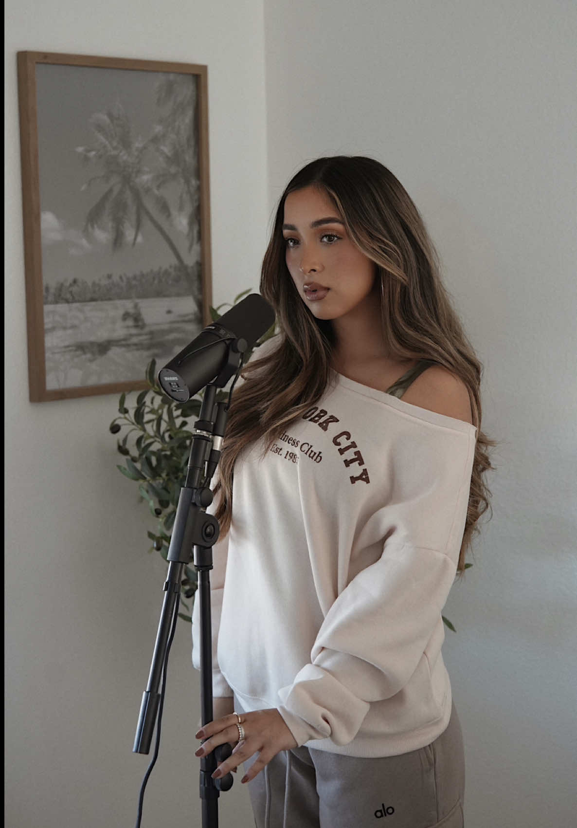 A post by @ on TikTok caption: Headphones on! 🫂🎧 A quick cover of 'Pins and Needles' by Nessa Barrett. #acousticcover #pinsandneedles #aylasinging 