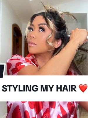 A post by @lianev on TikTok caption: Half up half down moment 💁🏻‍♀️🎀💋 PRODUCT DETAILS ❤️ @kerastase_official Genasis Fortifying Serum @bumbleandbumble Invisible Oil @ghd_northamerica Creative Curl Wand @thehairshopinc Hair Extensions  @amika Dry Shampoo @lorealparis Magic Root Cover Up @tresemme Hairspray Level 4 @benjaminbrand Red Bow Lips : @toofaced “Lady Bold” liner & @fentybeauty Stunna Lip Paint 