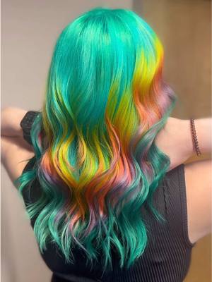 A post by @theresavandamstylist on TikTok caption: Obsessed🩵🩵🩵 #hairstylist #hairtok #hairdresser #fyp #vividhair #rainbowhair #rainbow #coloredhair 