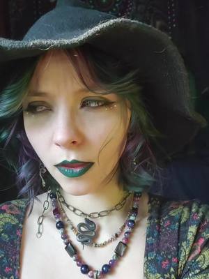 A post by @mavissky1 on TikTok caption: Ignore the smudged lipstick #drafts #witchy #imtheproblem #thatscute #goldeyes #occosplay #cosplay #darklipstick #fyp 