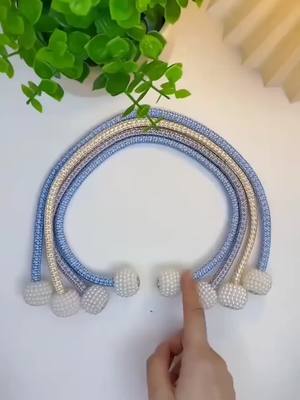 A post by @newlifehacks03 on TikTok caption: Such a beautiful curtain tie is recommended to you! It has strong magnetic attraction and looks good looking. Suitable for all kinds of curtains, just stick to the curtains when not in use. Beautiful and practical! #CurtainTie