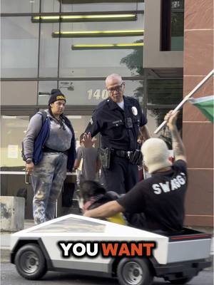 A post by @swagrman on TikTok caption: Replying to @Scenery ☀️ THOUGH MY FREEDOM WAS COMING TO AN END😂🙌 #police  #protest #losangeles #lapd #mexico #cybertruck #tesla 