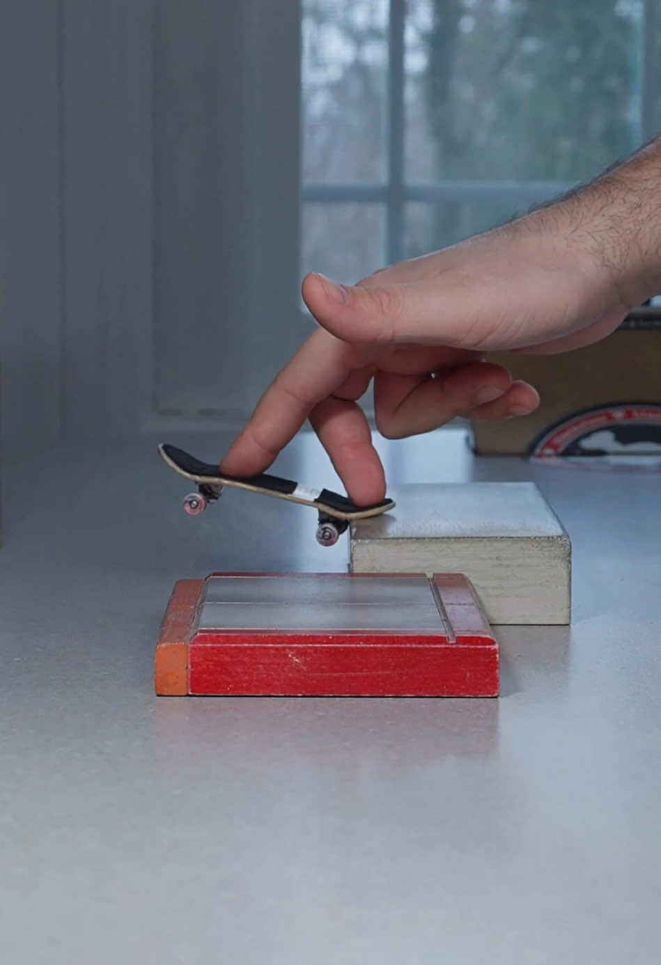 A post by @stonedboarder on TikTok caption: Name a trick that’s harder than it looks #fingerboard #fingerboards #skatelife #fingerskate #fyp #fingerboarding #skatespot #fingerboardtricks #skaters #techdeck #skatetricks 