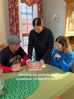 A post by @haileecatalano on TikTok caption: showing my parents my book for the first time 🥹❤️