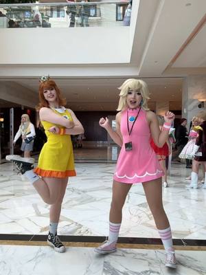 A post by @strifecos on TikTok caption: I still have more katsucon drafts to post😭 @kora.aura #mario #mariocosplay #princessdaisy #princesspeach #fyp 