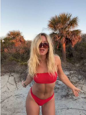 A post by @unaestheticsurferpearlz on TikTok caption: red bikini for the win @Hunza G 