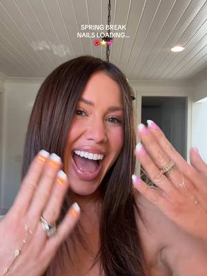 A post by @cecilybauchmann on TikTok caption: This is giving me y2k spring break vibes✨💕🫧🫶🏼I asked for french tip with orange & pink blooming gel hibiscus flowers and a rhindstone center! #nailinspo #nailtransition #springnails #springbreak #nails 