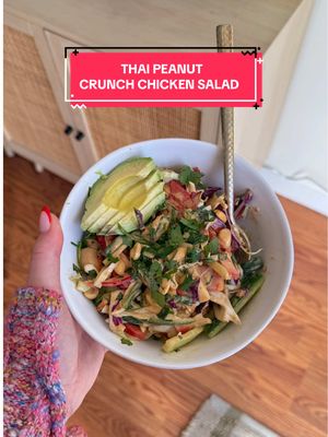 A post by @caileeeats on TikTok caption: thai peanut crunch chicken salad!! this would also be so good as a meal prepped lunch!! full recipe below 👇🏻  what you’ll need:  for the chicken:  1 1/2 lbs chicken thighs or breasts, cut into cubes 1 tbsp avocado oil 1 tsp salt 1/2 tsp pepper 1/2 tsp garlic powder  for the peanut dressing:  1/3 cup peanut butter 1/2 cup canned full-fat coconut milk 1/4 cup coconut aminos 2 tbsp rice vinegar 1 tbsp sriracha 1 clove of garlic  2 tsp ginger powder 1 tsp toasted sesame oil  for the salad base: bag of cabbage slaw 1/2 cup crushed peanuts 2 red bell peppers, thinly sliced 1 handful of cilantro, roughly chopped  1 bunch of green onions (green part only), thinly sliced  3-4 persian cucumbers, thinly sliced   optional toppings: Sliced avocados Fresh cilantro  Sesame seeds  instructions:  1. Preheat a pan to medium-high heat and add avocado oil. Cut the chicken into bite-sized pieces and season with salt, pepper, and garlic powder.  2. Add the chicken to the pan and cook for 10-12 minutes, stirring occasionally, until fully cooked.  3. While the chicken is cooking, make the peanut dressing. Add all the peanut dressing ingredients to a blender and blend on high for around 1 minute until fully smooth. Taste the dressing and add salt as necessary. Place in the fridge until you’re ready to assemble the salad.  4. Into a large bowl, add all the sliced veggies, peanuts, cilantro, and cooked chicken. Top everything with the peanut dressing and mix really well. Serve immediately and top with your choice of fresh avocado, sesame seeds, and/or cilantro. Enjoy! *If you plan on using this for meal prep, I suggest only adding the dressing right before you eat! #easydinneridea #healthydinneridea #mealpreplunchidea 