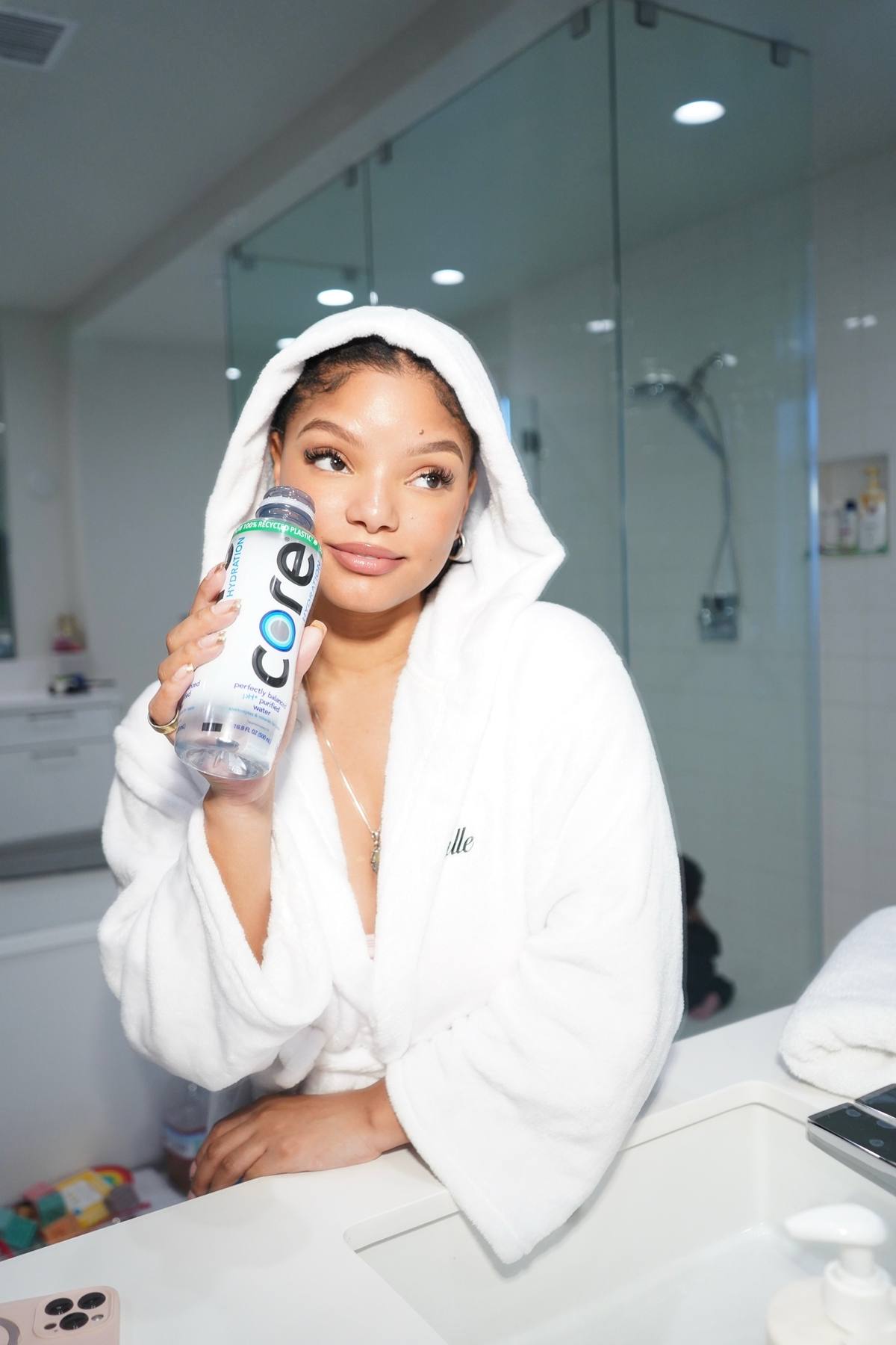 A post by @hallebailey on TikTok caption: #ad ending the day with a little self-care and a lot of hydration 🤍✨ here’s to nourishing my body from the inside out with @core. what’s your favorite way to unwind and stay balanced at the end of the day? #StartAtTheCore. 🤍✨