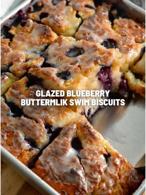 A post by @royaleeats on TikTok caption: Glazed Blueberry Buttermilk Swim Biscuits! Ingredients are posted below and full recipe is on my blog www.royaleeats.com Biscuits •2 ½ cups All-purpose Flour •⅓ cup Granulated White Sugar •1 tablespoon Baking Powder •2 teaspoons Fine Sea Salt •2 cups Whole Buttermilk •1 ½ cup Fresh Blueberries •½ cup Unsalted Butter, melted and cooled to room temperature Vanilla Glaze •1 cup Confectioners Sugar •3 tablespoons Whole Milk •1 teaspoon Vanilla Extract #royaleeats 