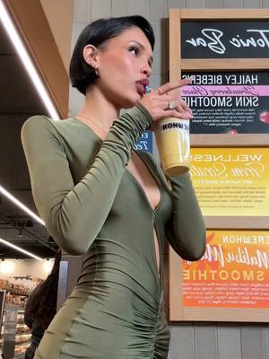 A post by @naraazizasmith on TikTok caption: ahhh it’s here! Wellness from scratch by Nara Smith @Erewhon Market let me know your thoughts👀 #fypシ #smoothie #drink 