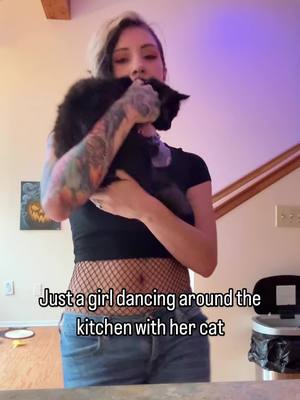 A post by @skylarcalico on TikTok caption: Our Wednesday morning routine. #cat #kitten #fyp #fypage #fishnets #dance #dancing #boricua #fypシ #fypage #blackcat 