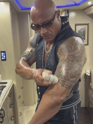 A post by @therock on TikTok caption: Final Boss’ final prep 🔥  #wwe @Papatui  #tattoostick 